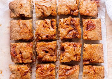 Gochujang blondie bars on parchment paper.