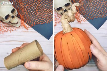 A brown toilet paper roll is transformed into an orange pumpkin with some paint, glue, and strips of old cereal boxes.