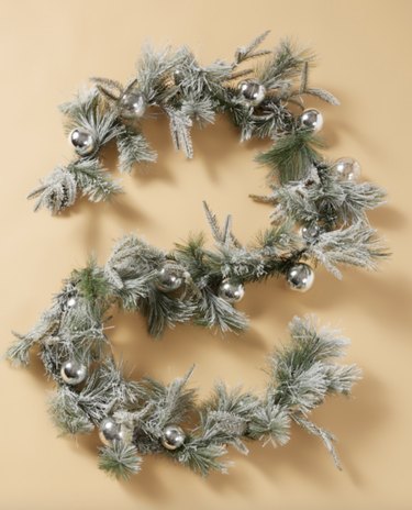 Flocked green garland with ornaments