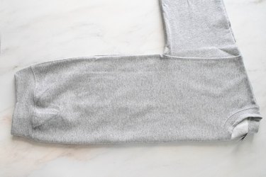 Gray sweatshirt folded in half