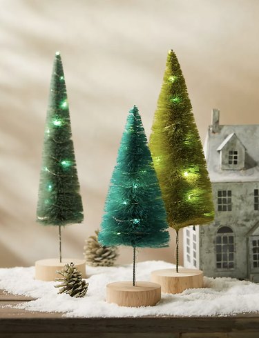 Three decorative green Christmas trees