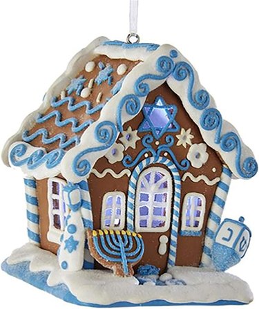 Small gingerbread house ornament decorated in Hanukkah theme