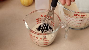 Whisking in black cocoa into pancake mix