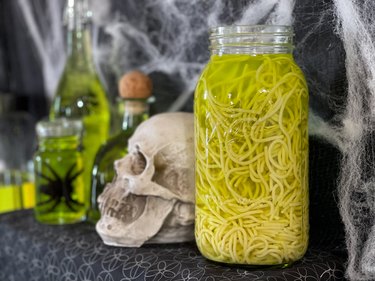 add spaghetti noodles to specimen jars