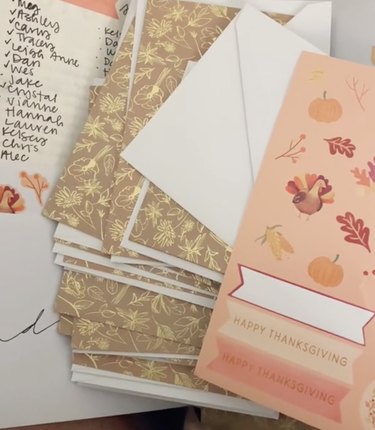 Pile of Thanksgiving cards decorated with leaves, turkeys, pumpkins and gold colors