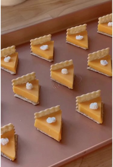 Mini "pumpkin pies" made from triangular cheese and crackers