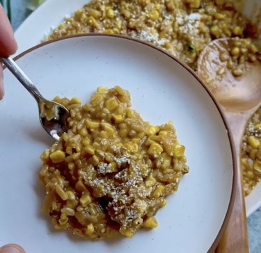 Corn risotto on a white plate