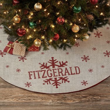 Snowflake Christmas tree skirt with the name "Fitzgerald"