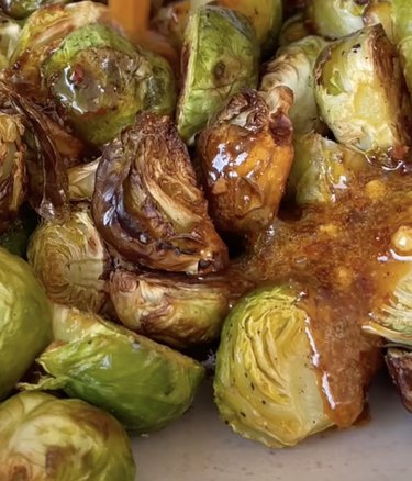 Pile of Brussels sprouts coated with a brown sauce