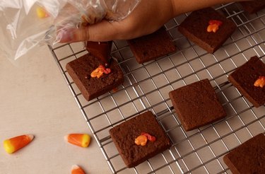 Adding turkey faces with melted chocolates.