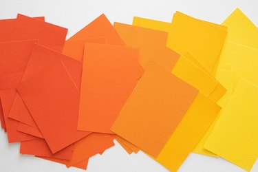 Sheets of orange and yellow card stock