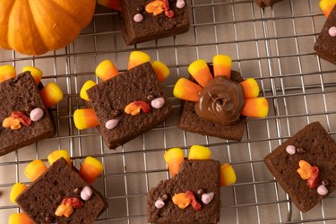 Chocolate shortbread turkeys on a wire rack.