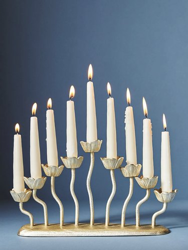 Gold floral menorah with white candles