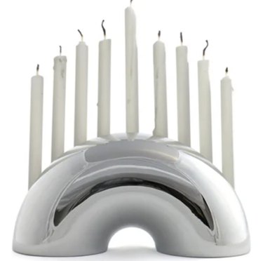 Silver modern menorah with white candles