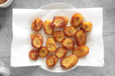 Transfer cooked plantains to a plate