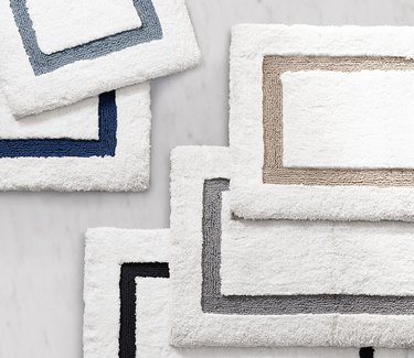 Five bath mats in different colors