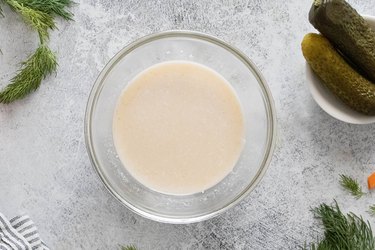 Sour cream and broth in bowl