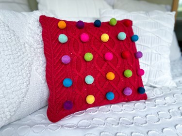 Red best sale sweater pillow