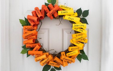 Wreath made from sheet music and wrapping paper. Glued together with hot  glue.