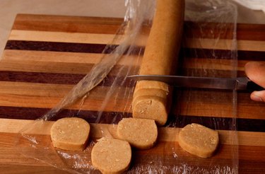 Slicing cookie dough with a knife