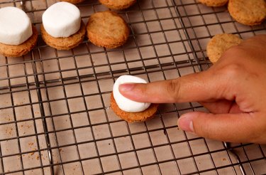 Topping shortbread cookie with a marshmallow half