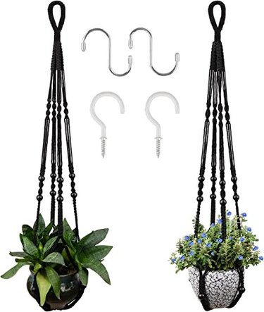 The macrame plant hangers have a contemporary look, are black , 35 inches long and come in a two pack.