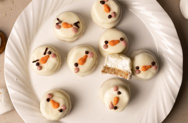 Snowman marshmallow treats on a white plate
