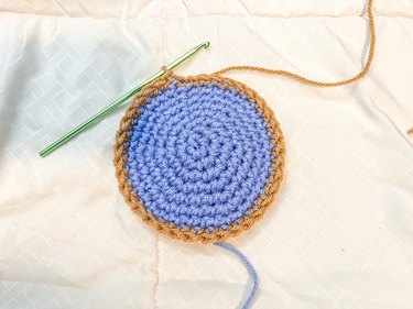 One row of beige single crochet added