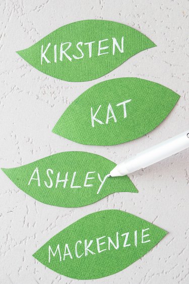 Write names on the  green paper leaves