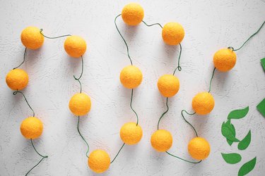 Embroidery thread with orange wool felt balls