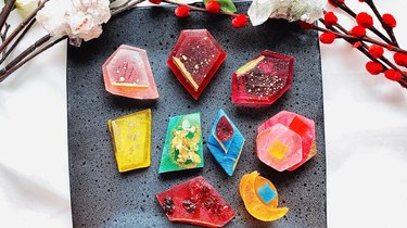 An assortment of red, pink, yellow, blue and green candies that look like crystals
