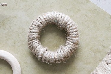 Wrap twine around wooden ring