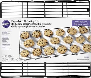 Wilton Expand & Fold cooling rack, shown in retail packaging on a white ground