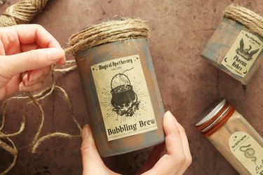Wrapping twine around a DIY potion bottle