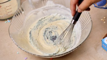 Whisking in butterfly pea flower powder
