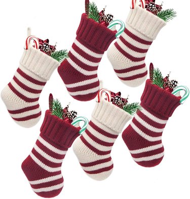 Six burgundy and white striped mini stockings
