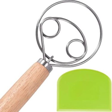 Sofease Danish-style dough whisk, pictured on a white ground along with a colorful plastic dough scraper that's included in the purchase