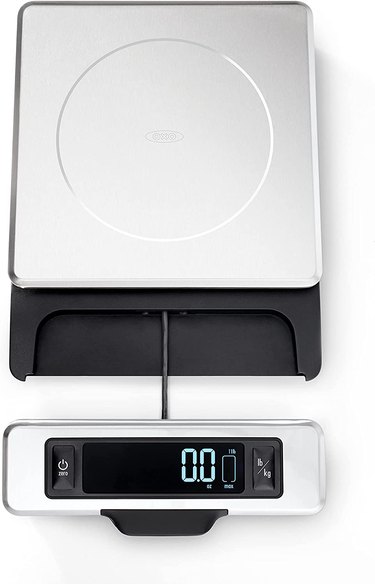 OXO Good Grips kitchen scale, with its display extended for visibility, shown on a white ground