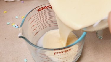 Dividing pudding into two containers