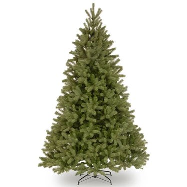 Realistic looking, unlit 7.5 foot Christmas tree against a white background.