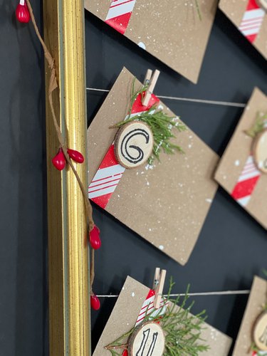 Clip envelopes to the "clotheslines" with little clothespins