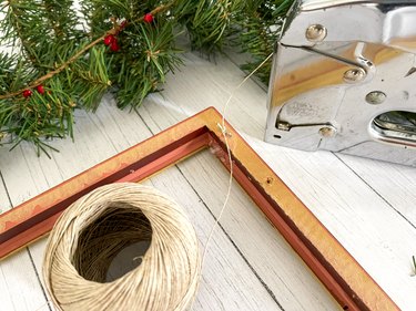 staple twine "clotheslines" across the back of the frame