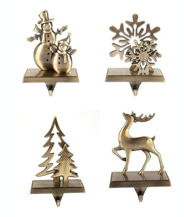 Four gold Christmas stocking holders in various designs