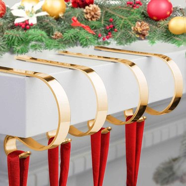 Four gold Christmas stocking holders