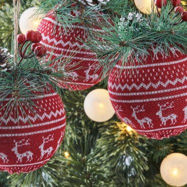 Red and white nordic knit ornament with deer