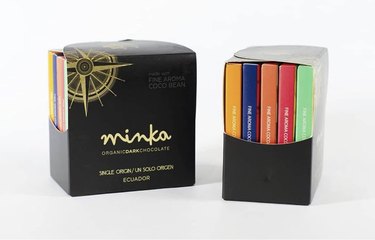 Gift box of Ecuadorian single-estate chocolates from Minka, shown in front and side views on a white ground