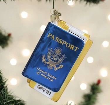 Passport ornament hanging on tree