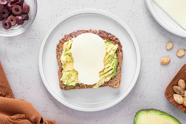 Skull-shaped cheese on top of avocado toast