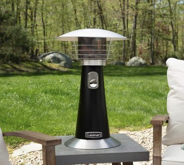 Cuisinart tabletop patio heater, shown on a concrete side table on a patio.