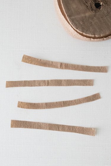 Cut strips of brown crepe paper